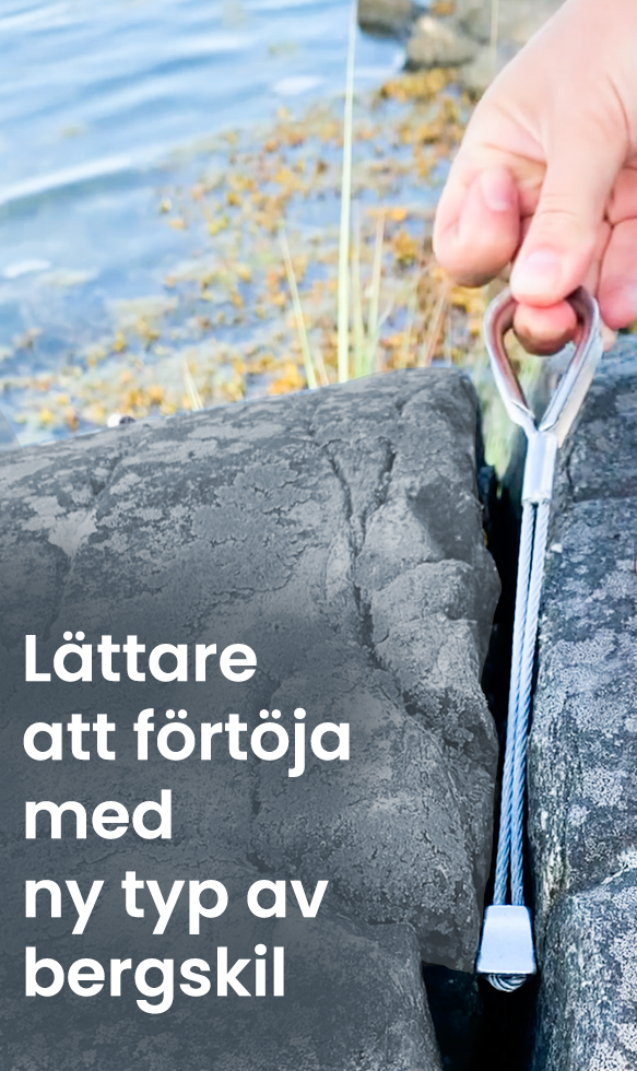 Lattare-att-fortoja-med-ny-typ-av-bergskil En bergskil sätts fast med en hand i en spricka i en naturhamn